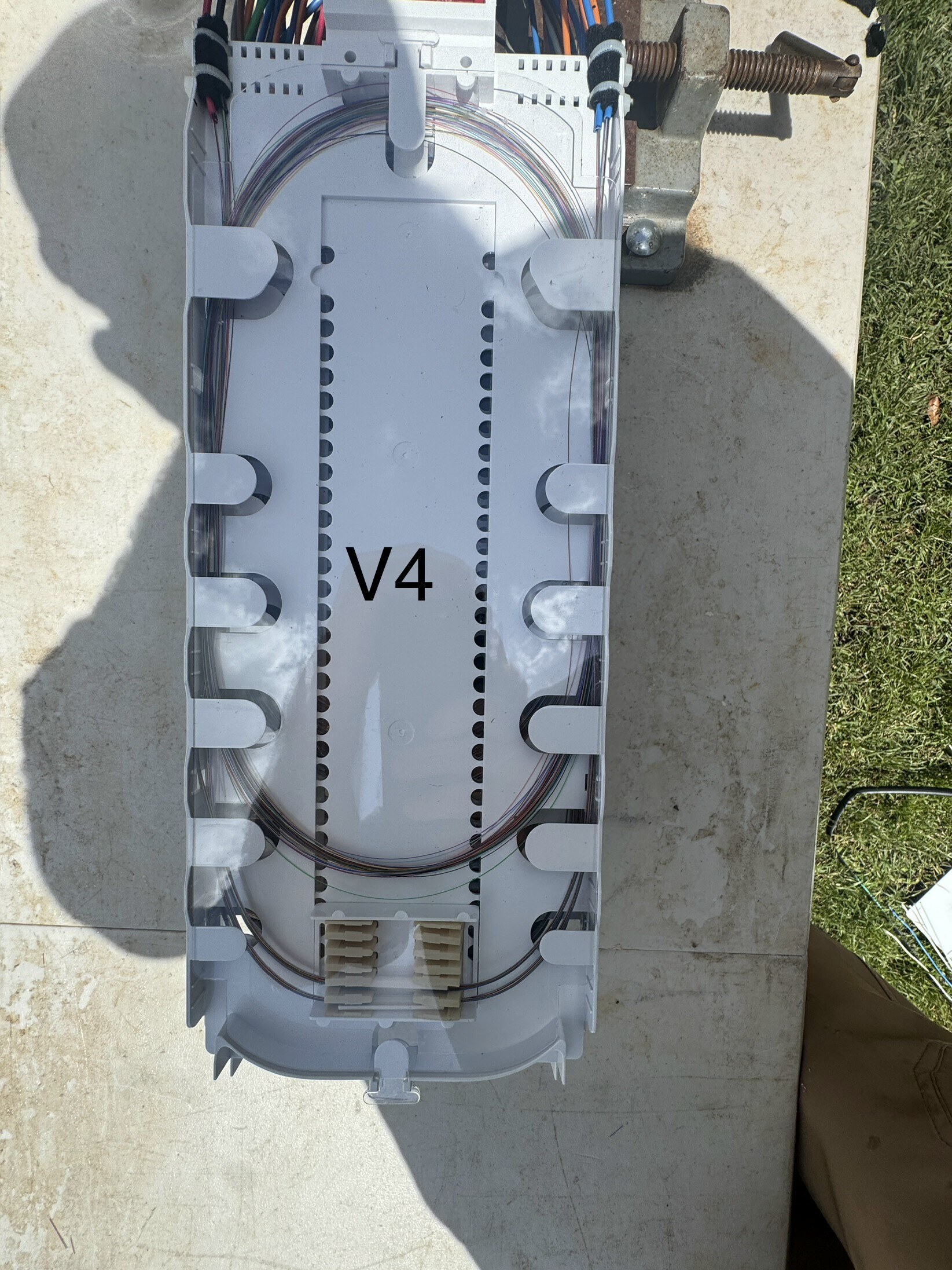 Second vault splice enclosure with organized fiber routing and splice sleeves